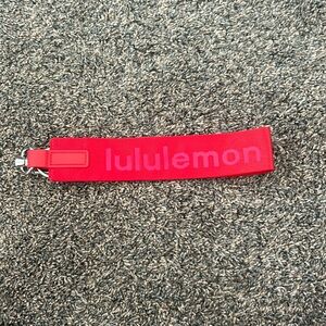 red lululemon never lost keychain